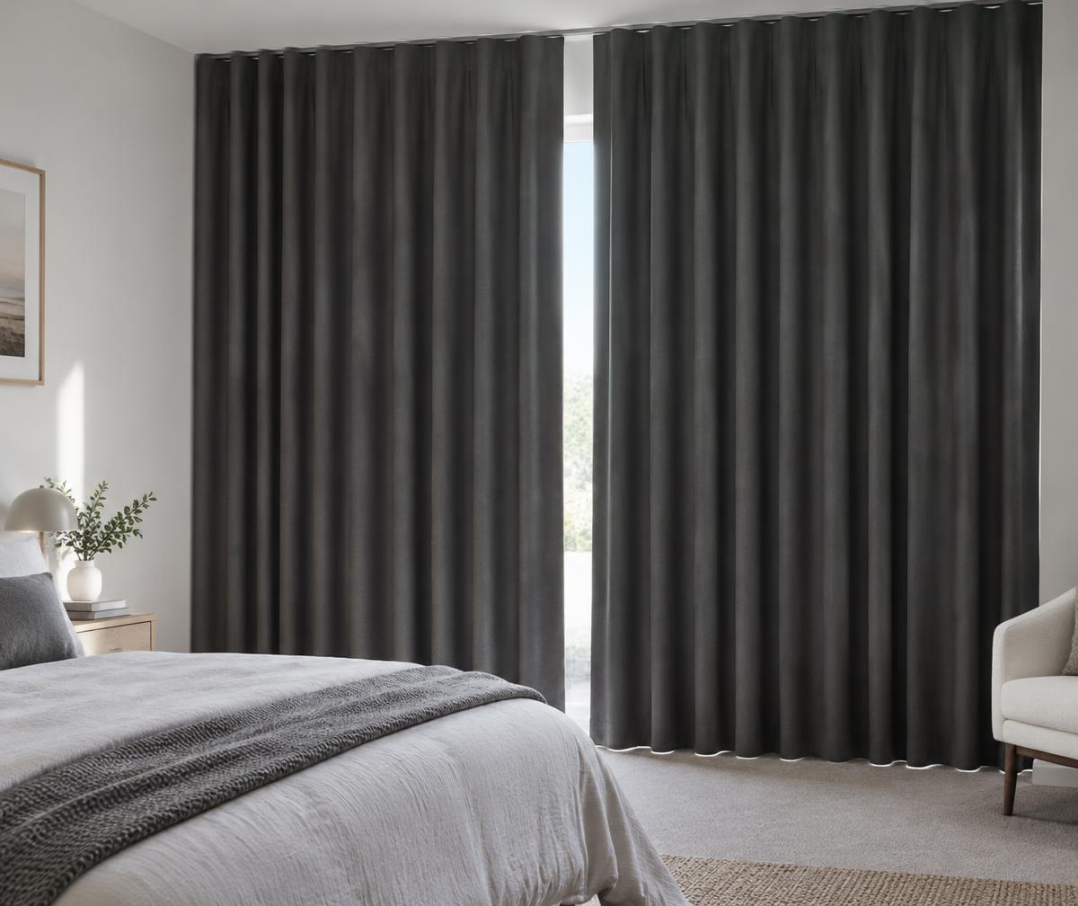 Illustrative opaque charcoal curtains drawn across a bedroom window