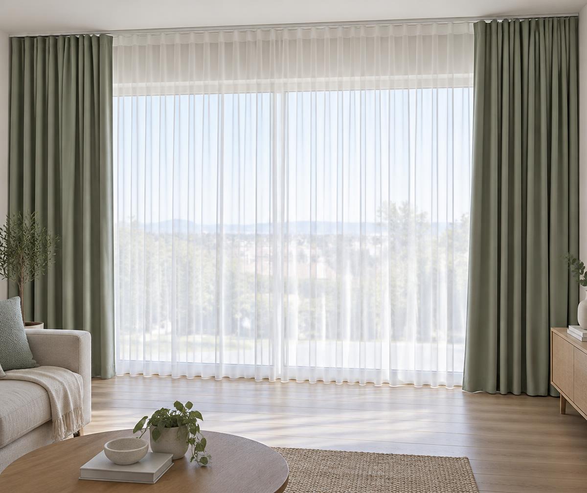 Illustrative white sheer curtains behind sage opaque drapes on separate tracks